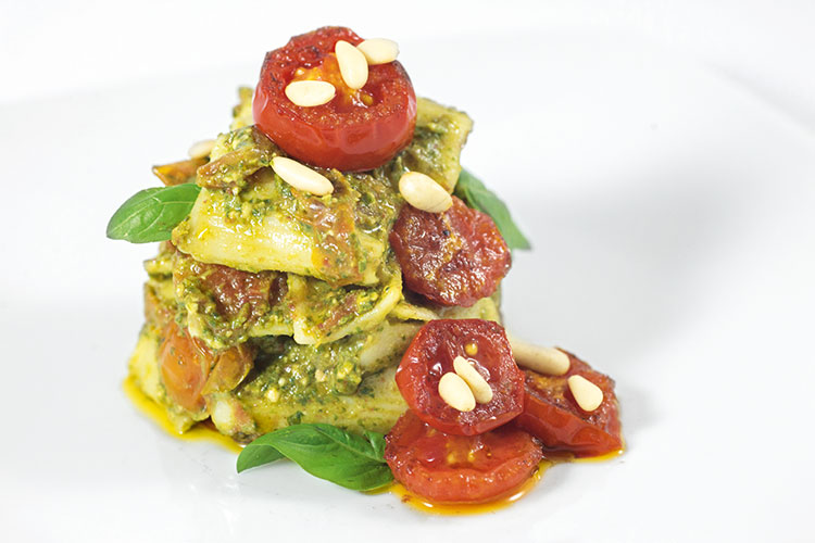 short rigatoni pasta with pesto and cherry tomatoes